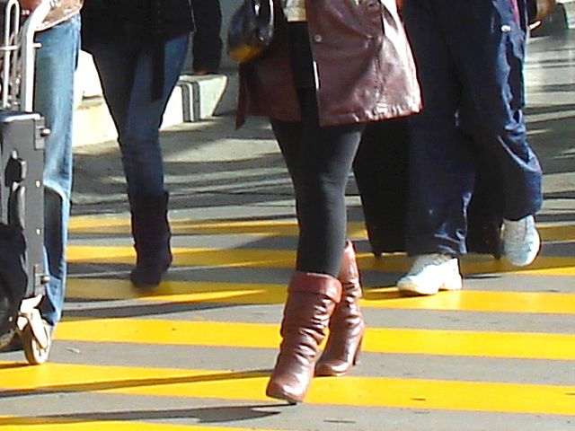 High heeled Boots and tights on yellow lines -  Bottes à talons hauts et collants sur lignes jaunes- Aéroport de Montréal.