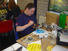 André bezig met paintbrush