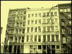 Windows & fire escapes- Fenêtres et escaliers de secours. Photofiltre - Photo à l'ancienne- Vintage effect.