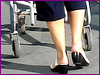 Blond mature in white sexy strappy sandals-  Dame blonde du bel âge en sandales blanches à courroies -  Aéroport de Montréal.