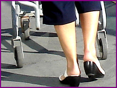 Blond mature in white sexy strappy sandals-  Dame blonde du bel âge en sandales blanches à courroies -  Aéroport de Montréal.