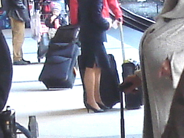 Blond flight attendant smoker in high heels shoes - Copenhagen train station airport  /  October 20th 2008