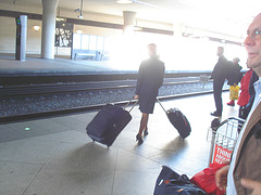 Blond flight attendant smoker in high heels shoes - Copenhagen train station airport  /  October 20th 2008