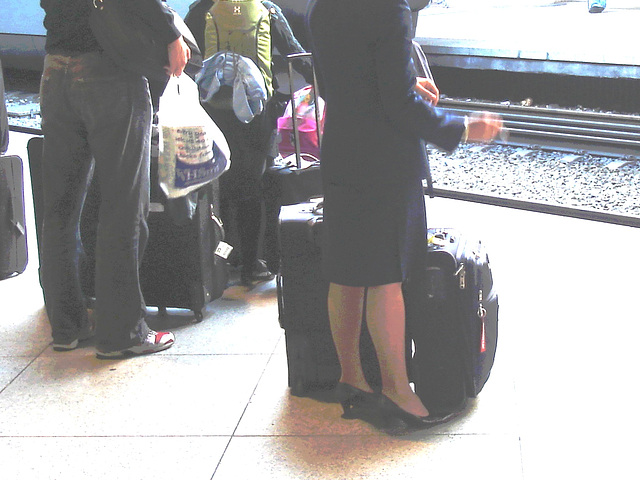 Blond flight attendant smoker in high heels shoes - Copenhagen train station airport  /  October 20th 2008