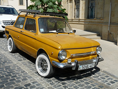 Mustard-coloured car- Unknown Make