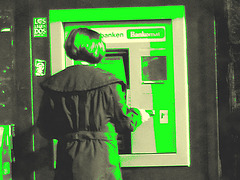 Redhead Lady at the ATM /  Rouquine au guichet automatique -  Ängelholm  /  Suède - Suède.  23 octobre 2008 -  Photo ancienne + avec changement de couleur