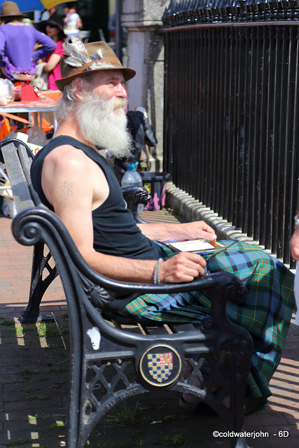 Mark Golding, artist, on Lewes High Street on a summer Saturday afternoon