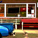 Bancs et derrière de camion bleu /  Benches and blue rear truck.   Brighton.  USA.   23 -05-2009  - Yes we're open. Postérisation