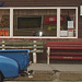 Bancs et derrière de camion bleu /  Benches and blue rear truck.   Brighton.  USA.   23 -05-2009-  Yes we're open.