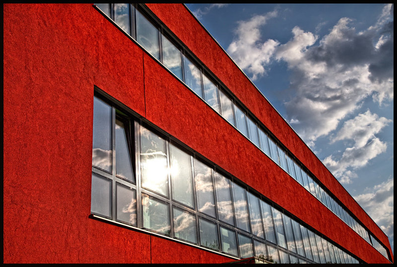 the red building and the face in the sky