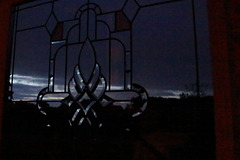 East Sussex summer night through Stained Glass staircase window