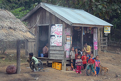 Young villagers at a store beside the national main road