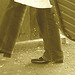 Direkten hatter in chunky heeled shoes and sexy skirt /  Suédoise à chapeau en jupe sexy et souliers à talons trapus /   Ängelholm /  Suède - Sweden.  23/10/2008 - Sepia