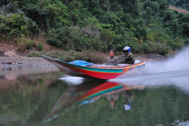 Speed boat going upstream the Nam Ou