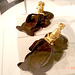 Unusual sandals with golden miniature statues adornment