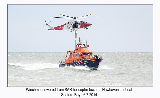 Winchman lowered towards Lifeboat - RNLI & Coastguard Joint Exercise - Seaford Bay - 6.7.2014