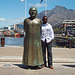 Jean Bosco kun la monumento de D. TUTU