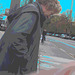 Street corner curly Mature Lady in sexy high-heeled boots and jeans /  Dame mature aux cheveux bouclés en bottes à talons hauts et jeans -  Copenhage, Danemark.  19-10-2008   - Ciel bleu photofiltré + postérisation