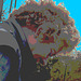 Street corner curly Mature Lady in sexy high-heeled boots and jeans /  Dame mature aux cheveux bouclés en bottes à talons hauts et jeans -  Copenhage, Danemark.  19-10-2008  - Ciel bleu photofiltré  + postérisation