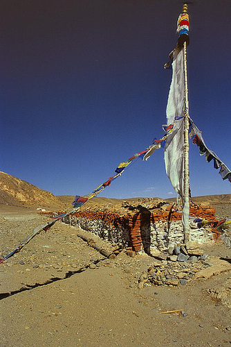 Long mani wall and a prayer flag