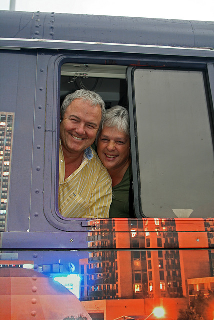 Uncle Jack, Aunt Debbie, at a Window of their Bus