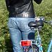 Cycliste en bottes à talons hauts / Walking Swedish biker in jeans & high-heeled boots at her cell phone - Ängelholm  / Suède - Sweden.  23-10-2008