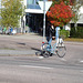 Cycliste en bottes à talons hauts / Walking Swedish biker in jeans & high-heeled boots at her cell phone - Ängelholm  / Suède - Sweden.  23-10-2008