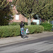 Cycliste en bottes à talons hauts / Walking Swedish biker in jeans & high-heeled boots at her cell phone - Ängelholm  / Suède - Sweden.  23-10-2008