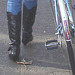 Cycliste en bottes à talons hauts / Walking Swedish biker in jeans & high-heeled boots at her cell phone - Ängelholm  / Suède - Sweden.  23-10-2008