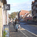 Cycliste en bottes à talons hauts / Walking Swedish biker in jeans & high-heeled boots at her cell phone - Ängelholm  / Suède - Sweden.  23-10-2008