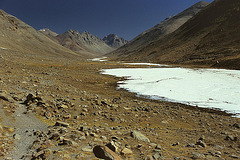Snow covered Lhachu river in the valley