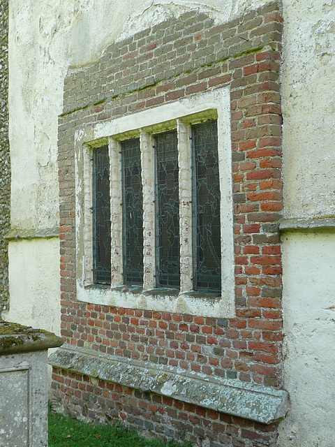 belchamp walter church, essex, john boutetort, c14 tomb canopy with square cut hole to cusps in line with tudor window. contemporary paintings cover the walls.c.1325