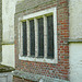 belchamp walter church, essex, john boutetort, c14 tomb canopy with square cut hole to cusps in line with tudor window. contemporary paintings cover the walls.c.1325