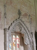 belchamp walter church, essex, john boutetort, c14 tomb canopy with square cut hole to cusps in line with tudor window. contemporary paintings cover the walls.c.1325