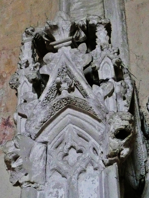 belchamp walter church, essex, john boutetort, c14 tomb canopy with square cut hole to cusps in line with tudor window. contemporary paintings cover the walls.c.1325