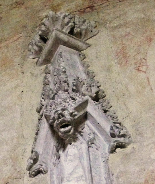 belchamp walter church, essex, john boutetort, c14 tomb canopy with square cut hole to cusps in line with tudor window. contemporary paintings cover the walls.c.1325