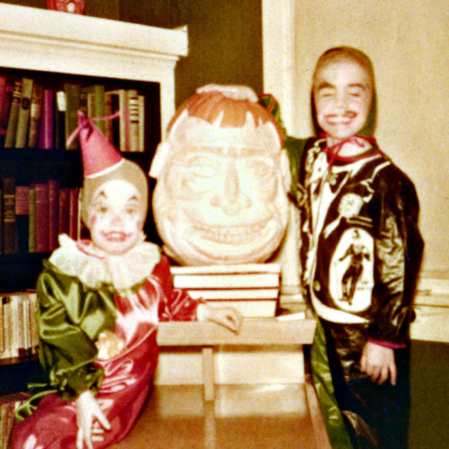 Sister Karen and me at Halloween, 1952.  She, a clown and I, Dr. Jekyll AND Mr. Hyde, depending which side of the costume was facing the observer. Also, dad's pumpkin sculpture that creeped me out.