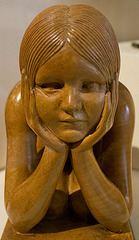 Kneeling girl carving
