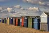 Beach Huts under sunny skies.