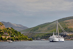 A ferry ship passes the Franjo Tuđman bridge