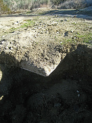 Corner of an old slab foundation exposed by the flood at Miracle Hill & Two