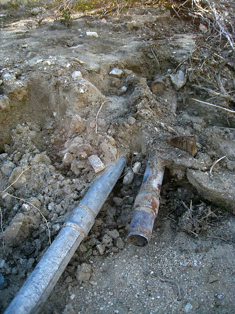 Old water pipe exposed by erosion at Miracle Hill & Two Bunch Palms Trail (6