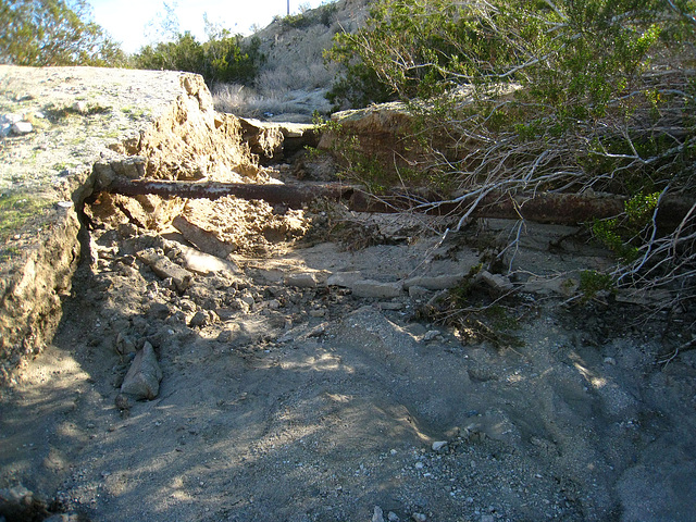 Old water pipe exposed by erosion at Miracle Hill & Two Bunch Palms Trail (6