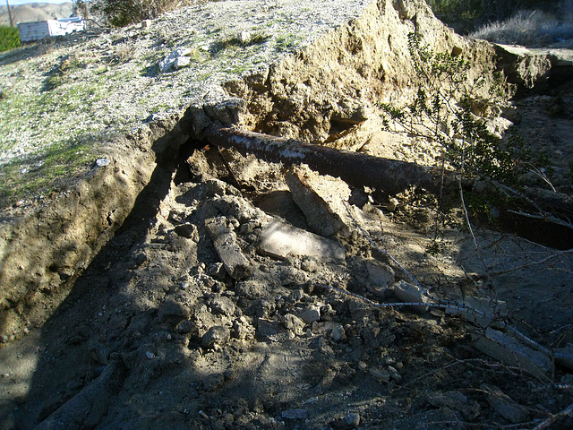 Old water pipe exposed by erosion at Miracle Hill & Two Bunch Palms Trail (6