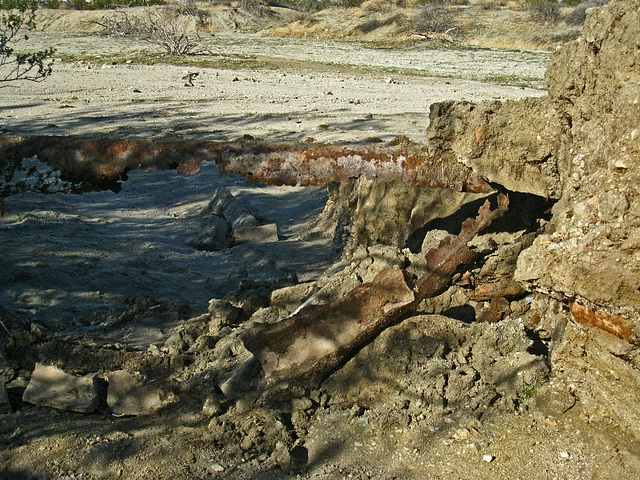 Old water pipe exposed by erosion at Miracle Hill & Two Bunch Palms Trail (6