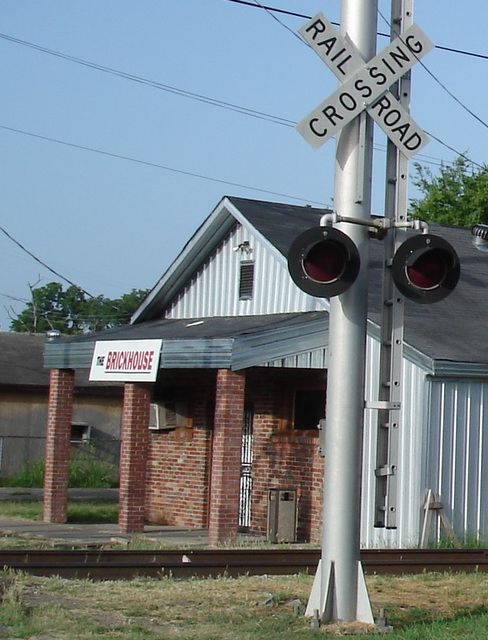 The Brickhouse by the railroad crossing