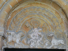 church hanborough c12 tympanum.st.peter with lion of st.mark and agnus dei. cock at peter's feet. what is refered to as the hand of god is in fact the end of the lion's tail next to the wing of the lion. books keep on getting this wrong.