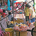 Fruit stall and passing customers