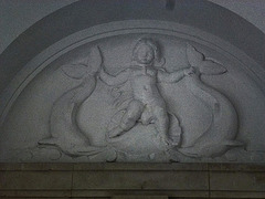 naval war memorial, great lines, chatham, kent c20Cherub on shell with dolphins, tympanum inside one of maufe's post 1945 pavilions