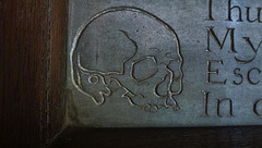 sandon church, essex,skull detail on incised tomb memorial to deborah smith , 1647, on the south wall of the chancel